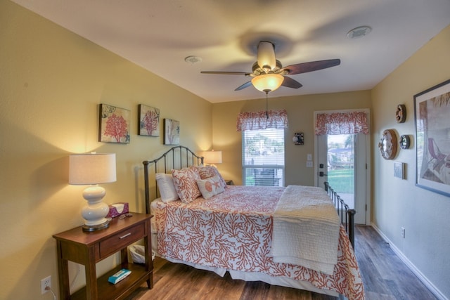 bedroom with baseboards, wood finished floors, ceiling fan, and access to outside