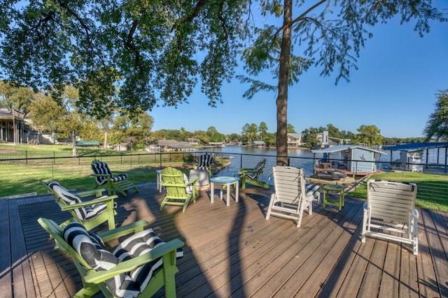 deck featuring a yard and a water view