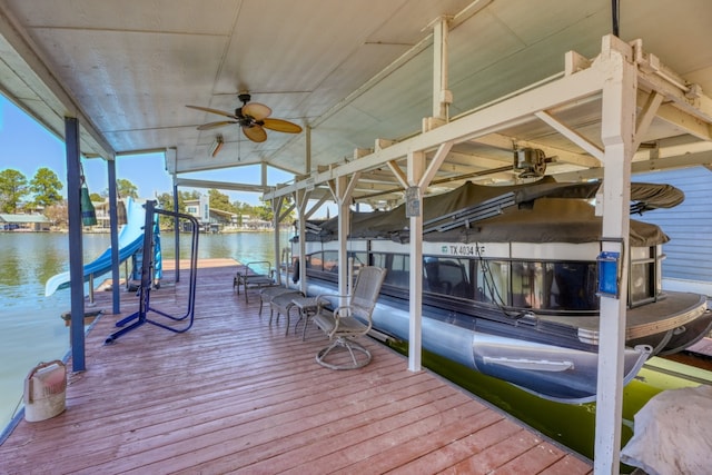 dock area featuring a water view and boat lift