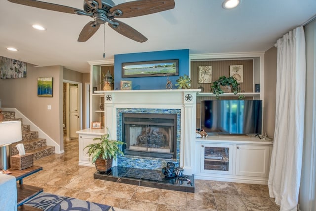 living room with stairs, baseboards, recessed lighting, and a fireplace