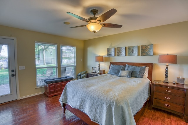 bedroom with a ceiling fan, baseboards, and wood finished floors