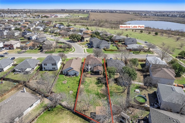 aerial view featuring a residential view and a water view