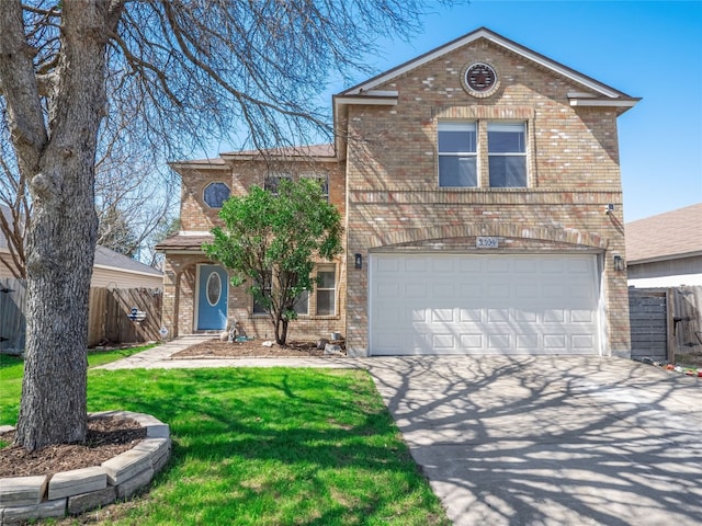 traditional-style house with concrete driveway, fence, and brick siding