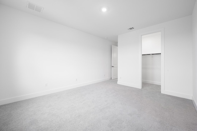 1821 Novara Trl, Leander, TX 78641 - unfurnished bedroom with baseboards, light colored carpet, recessed lighting, and a closet