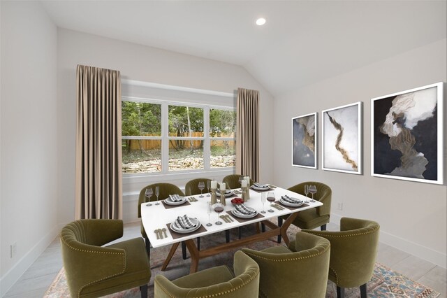 dining room with recessed lighting, baseboards, and vaulted ceiling