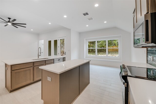 kitchen featuring visible vents, an island with sink, a sink, recessed lighting, and appliances with stainless steel finishes