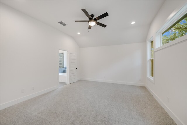 unfurnished room featuring visible vents, baseboards, lofted ceiling, recessed lighting, and light colored carpet