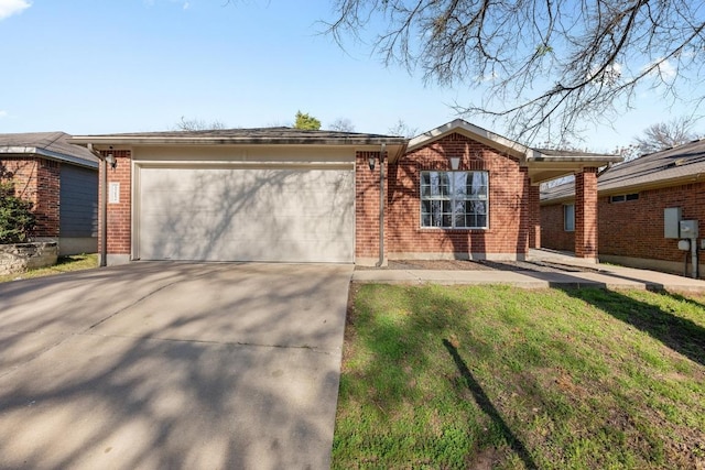 ranch-style home with brick siding, concrete driveway, and a garage