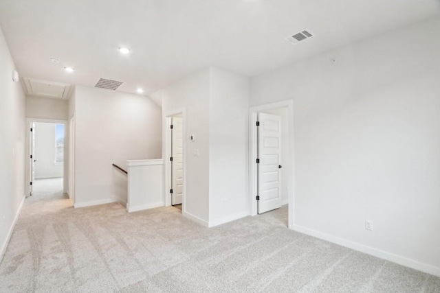 unfurnished room with recessed lighting, visible vents, and light carpet