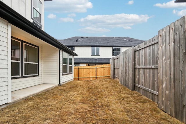 view of yard with a fenced backyard