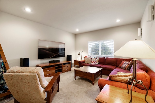 living room with recessed lighting and light colored carpet