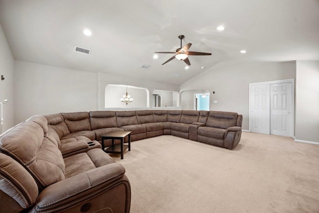 living room with lofted ceiling, recessed lighting, light colored carpet, and visible vents