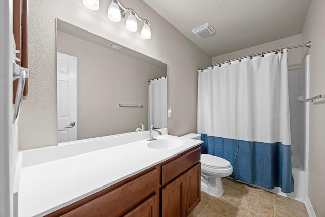 full bath featuring tile patterned flooring, visible vents, toilet, shower / bath combo with shower curtain, and vanity