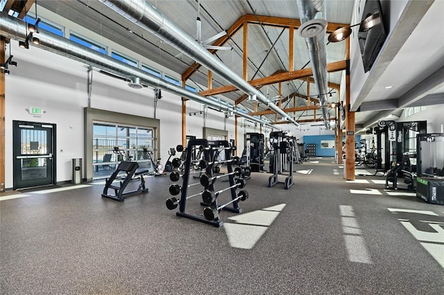 workout area with high vaulted ceiling