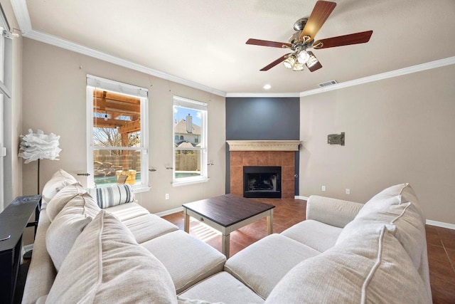 tiled living room featuring visible vents, crown molding, and baseboards