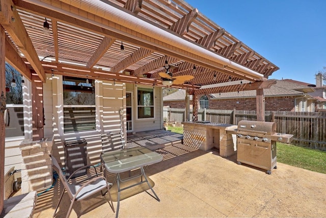 view of patio / terrace with grilling area, fence, and a pergola