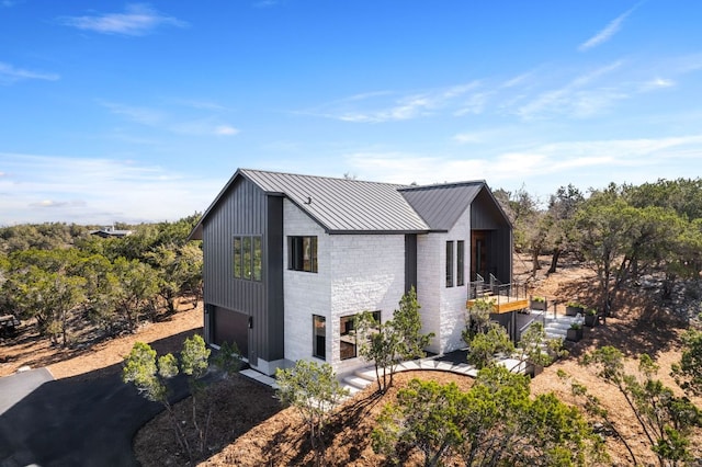 view of home's exterior featuring metal roof and a standing seam roof