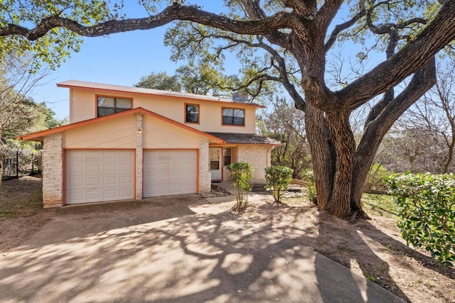 traditional home with brick siding and driveway