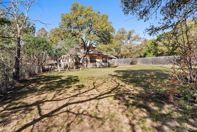 view of yard featuring a fenced backyard