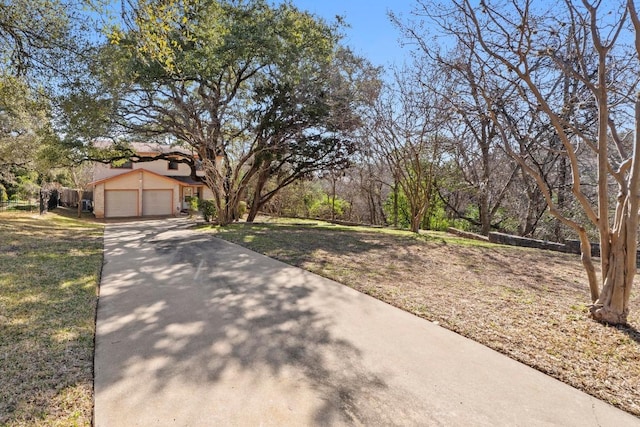 view of front of house with a front lawn and a garage