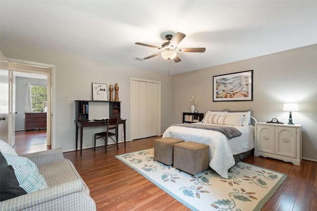 bedroom featuring a closet, visible vents, ceiling fan, and light wood-style floors