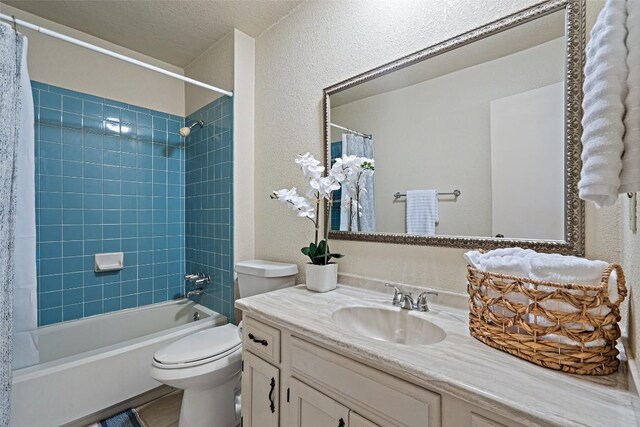 4703 White Elm Ct, Austin, TX 78749 - full bathroom with vanity, shower / bath combination with curtain, a textured wall, and a textured ceiling