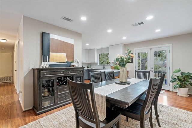 4703 White Elm Ct, Austin, TX 78749 - dining area with light wood-style flooring, french doors, and recessed lighting