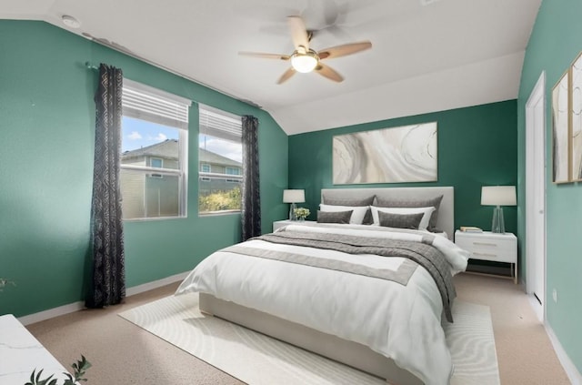 bedroom with lofted ceiling, baseboards, carpet floors, and ceiling fan