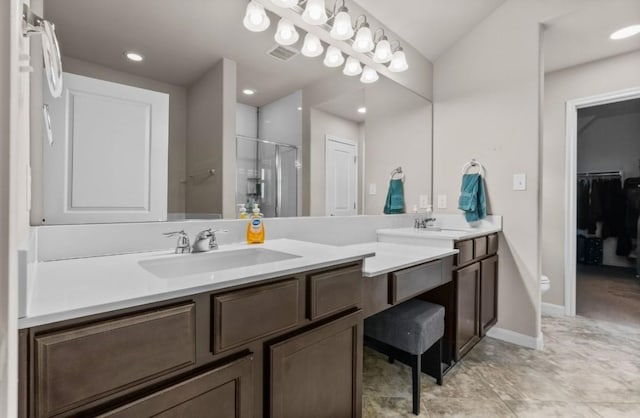 full bathroom featuring baseboards, visible vents, double vanity, a sink, and a shower stall