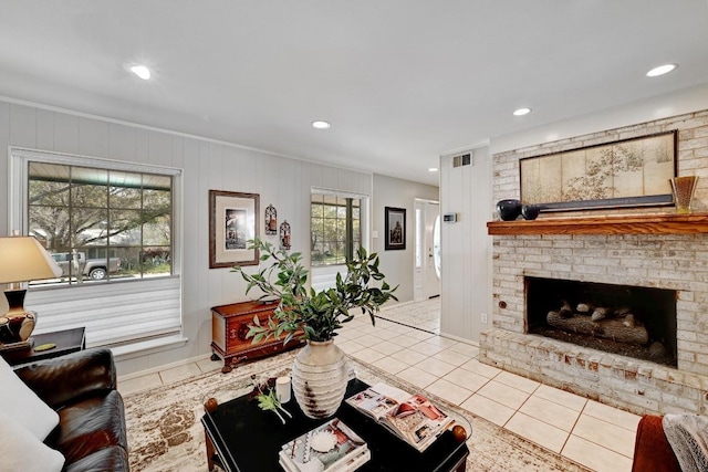 living room with tile patterned floors, visible vents, recessed lighting, and a brick fireplace