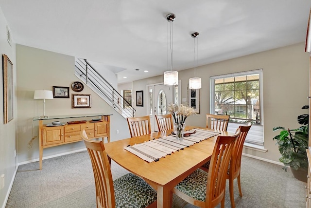 carpeted dining area featuring stairway, recessed lighting, and baseboards