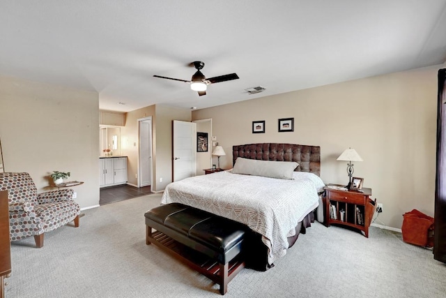 carpeted bedroom with visible vents, ceiling fan, and baseboards