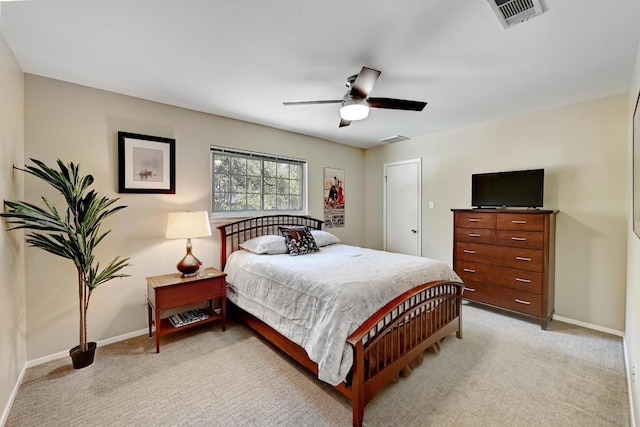 bedroom with visible vents, baseboards, and light colored carpet