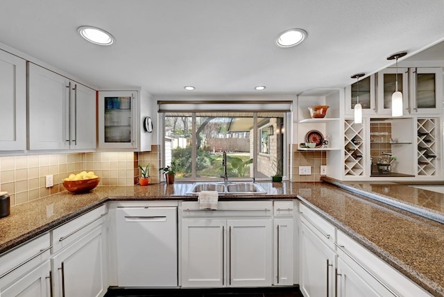 kitchen with open shelves, white cabinets, tasteful backsplash, and a sink