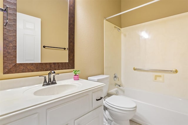 bathroom featuring washtub / shower combination, toilet, and vanity