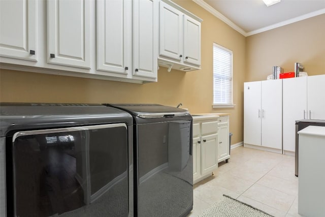 laundry room featuring washer and clothes dryer, light tile patterned floors, cabinet space, and ornamental molding