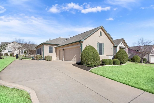 view of front facade with a garage, stucco siding, driveway, and a front lawn