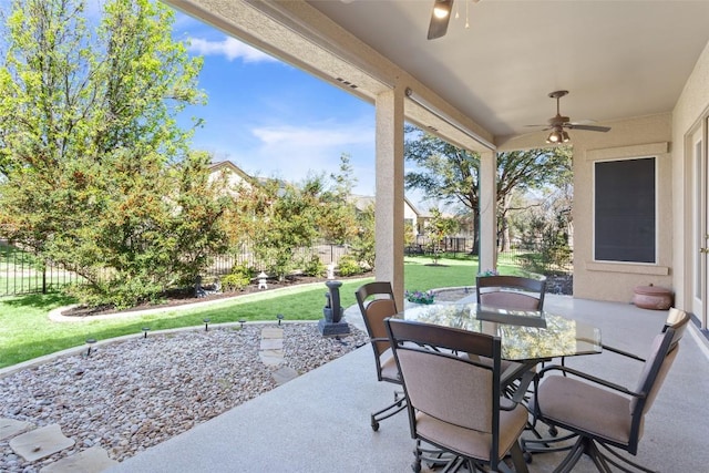 view of patio / terrace featuring outdoor dining space, fence private yard, and ceiling fan