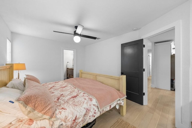 bedroom with light wood-type flooring and a ceiling fan