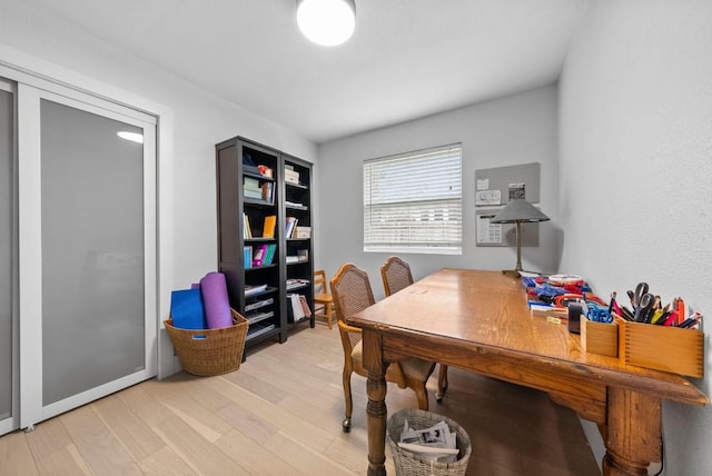 office with light wood-type flooring