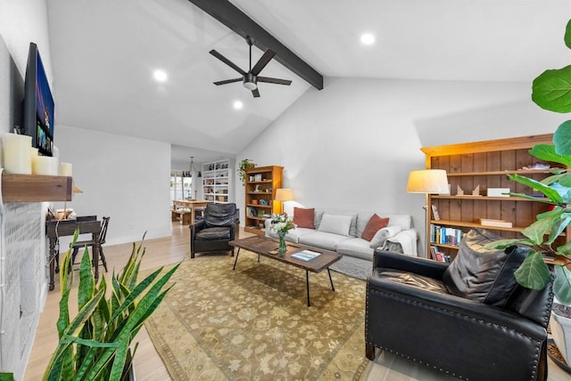 living room featuring wood finished floors, high vaulted ceiling, recessed lighting, ceiling fan, and beamed ceiling