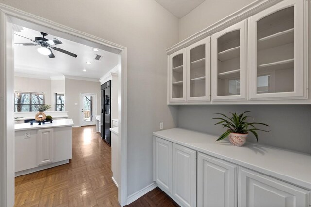 bar featuring visible vents, baseboards, recessed lighting, ceiling fan, and ornamental molding