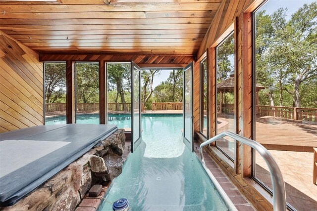 view of swimming pool featuring a wooden deck and a pool