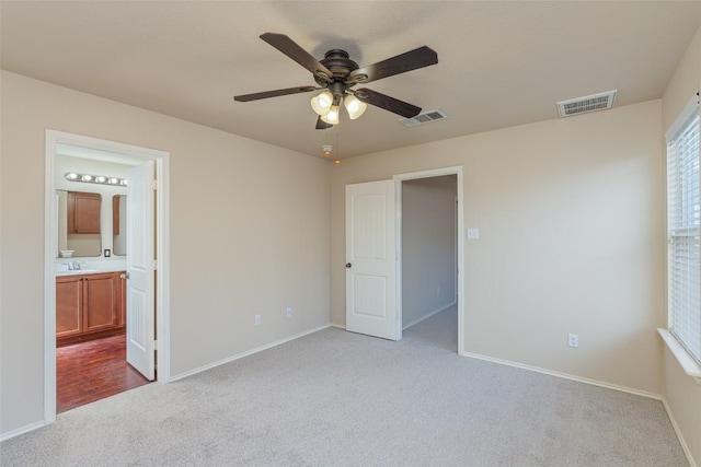 714 Alamo Plaza Dr, Cedar Park, TX 78613 - unfurnished bedroom with carpet floors, connected bathroom, and a ceiling fan