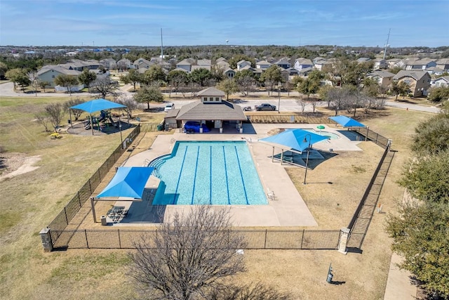 pool featuring a gazebo, a residential view, and fence