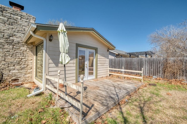 exterior space with french doors and fence