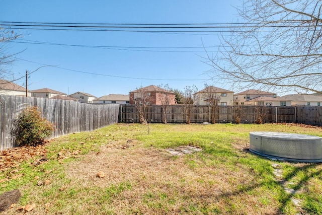 view of yard featuring a residential view and a fenced backyard