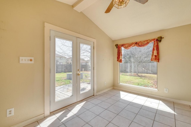 interior space with a ceiling fan, french doors, tile patterned flooring, baseboards, and vaulted ceiling with beams