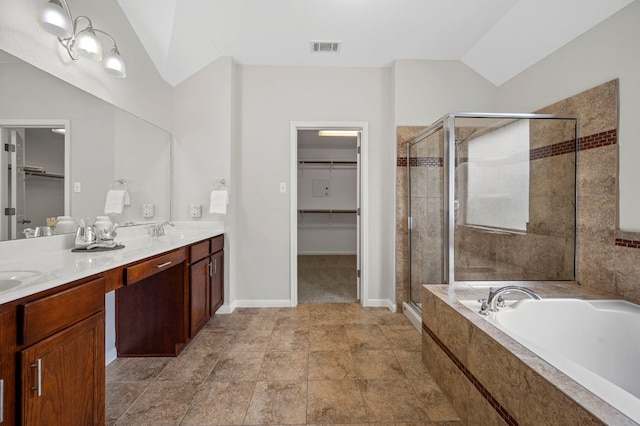 full bath with lofted ceiling, a garden tub, visible vents, and a stall shower