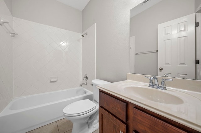 bathroom featuring tile patterned flooring, visible vents, toilet, bathtub / shower combination, and vanity